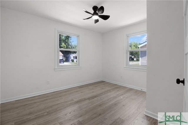 spare room with ceiling fan and light hardwood / wood-style floors