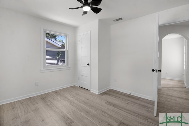 spare room featuring light hardwood / wood-style flooring and ceiling fan