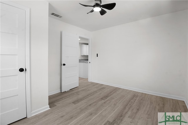 unfurnished bedroom with ceiling fan and light hardwood / wood-style floors