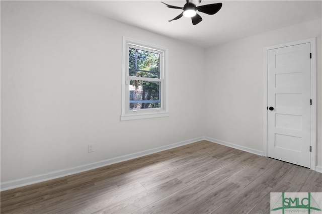 spare room featuring ceiling fan and light hardwood / wood-style floors