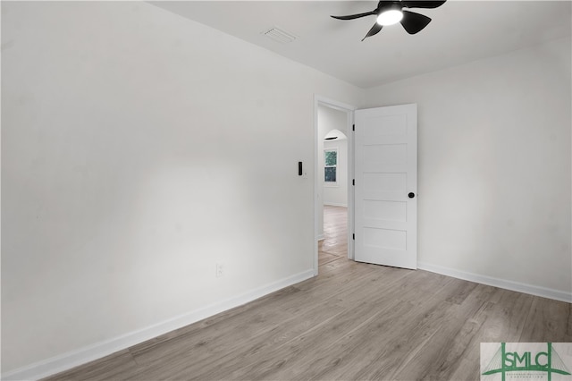 spare room featuring ceiling fan and light wood-type flooring