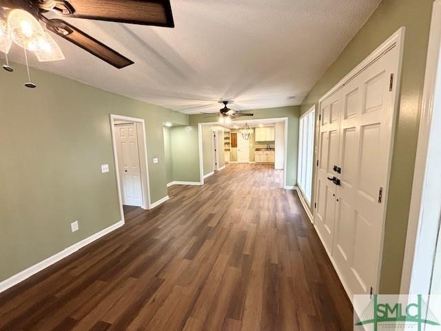 interior space with dark hardwood / wood-style floors and a textured ceiling