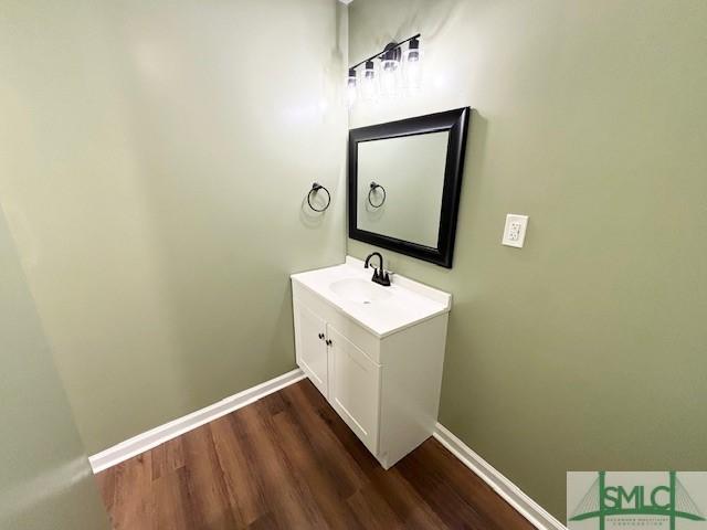 bathroom featuring hardwood / wood-style floors and vanity