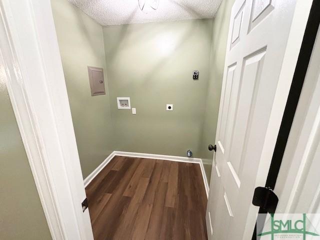 laundry room featuring washer hookup, electric dryer hookup, wood-type flooring, and a textured ceiling