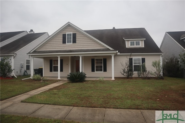 view of front of property with covered porch and a front lawn