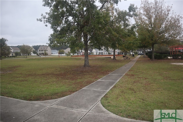 view of community featuring a lawn