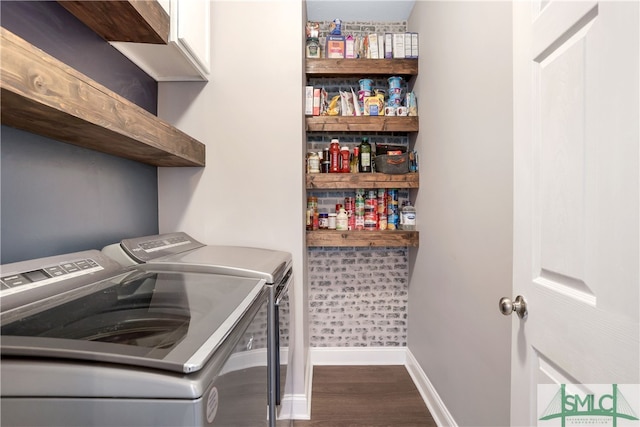 laundry area featuring dark hardwood / wood-style flooring and independent washer and dryer