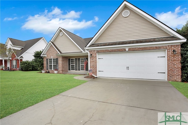 view of front of home with a front yard and a garage