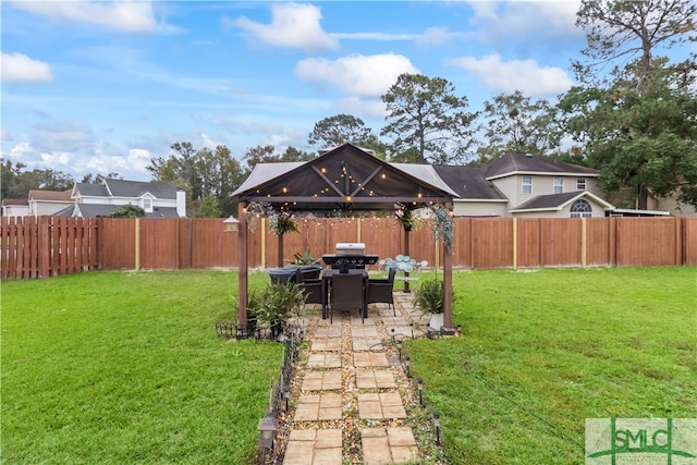 view of yard with a gazebo and a patio