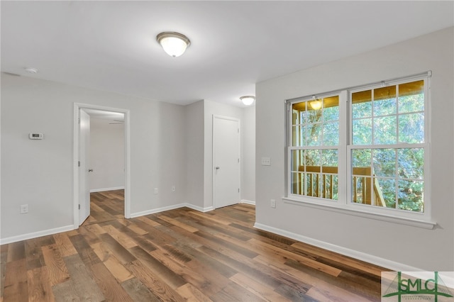 empty room featuring dark hardwood / wood-style floors