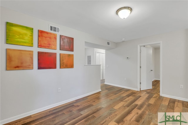 spare room featuring hardwood / wood-style flooring