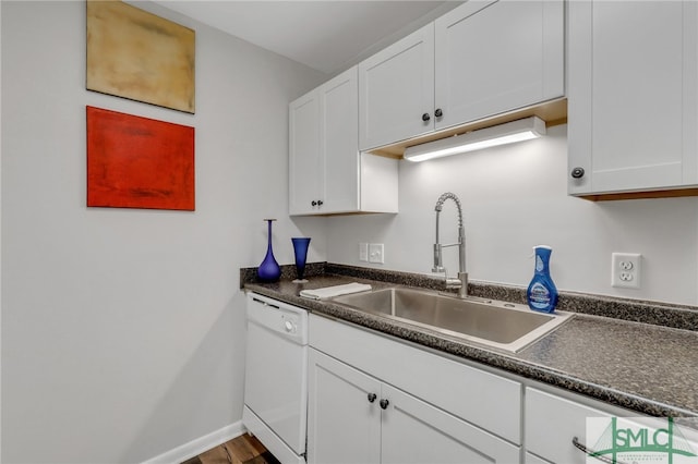 kitchen with white dishwasher, dark hardwood / wood-style flooring, white cabinetry, and sink