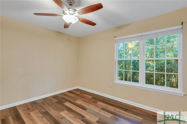 unfurnished room featuring ceiling fan and hardwood / wood-style floors