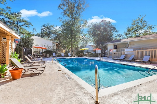 view of swimming pool with a patio area