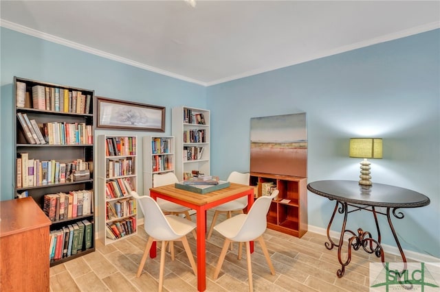 dining area with light wood-type flooring and ornamental molding