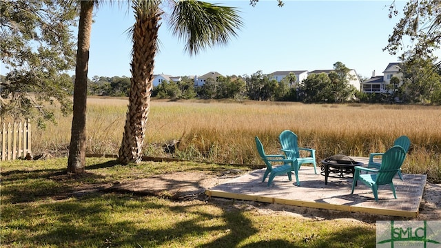 view of yard featuring a patio and an outdoor fire pit