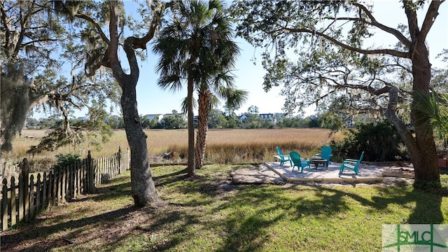 view of yard with a patio and a rural view