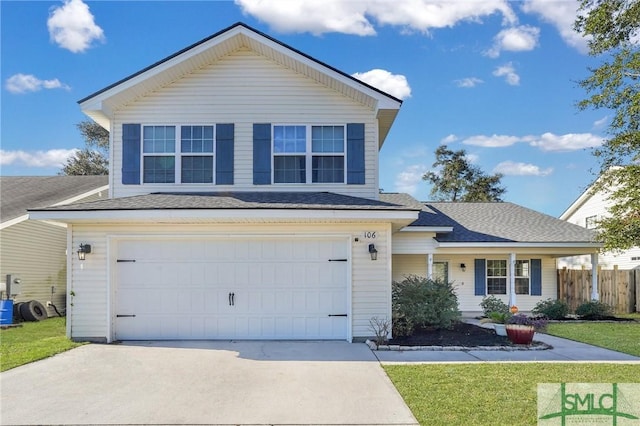 front facade featuring a front lawn and a garage