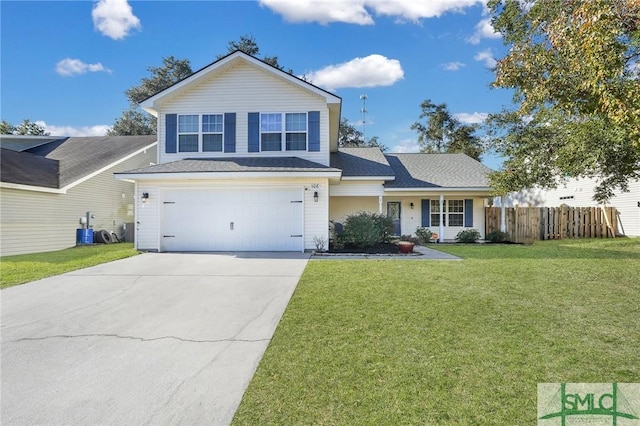 view of property with a front yard and a garage