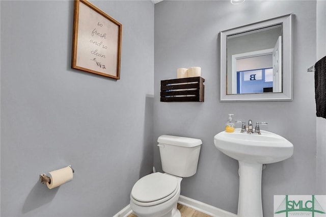 bathroom with toilet and sink