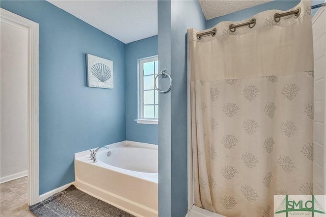 bathroom with plus walk in shower and a textured ceiling