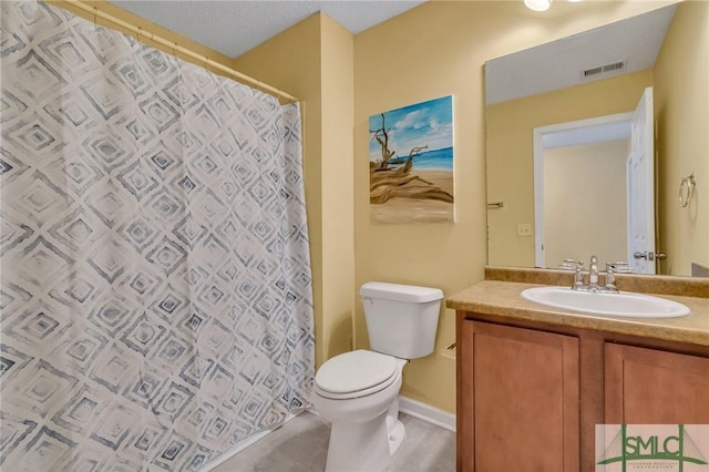 bathroom featuring toilet, walk in shower, and vanity