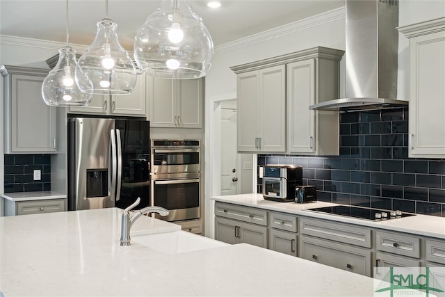 kitchen with decorative backsplash, wall chimney exhaust hood, stainless steel appliances, sink, and gray cabinets