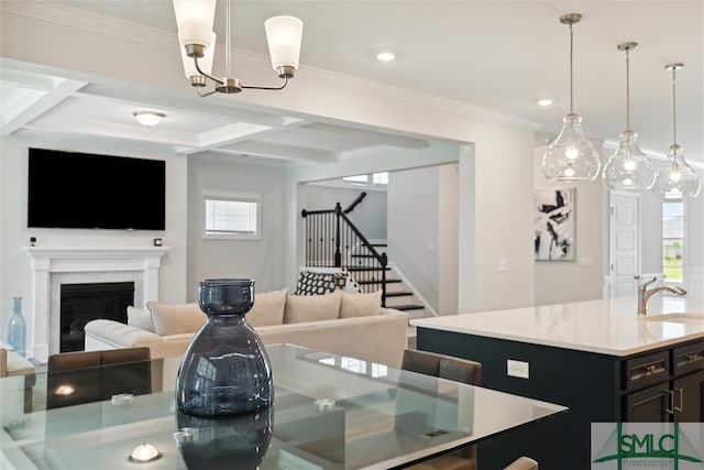 dining room with coffered ceiling, a fireplace, and plenty of natural light