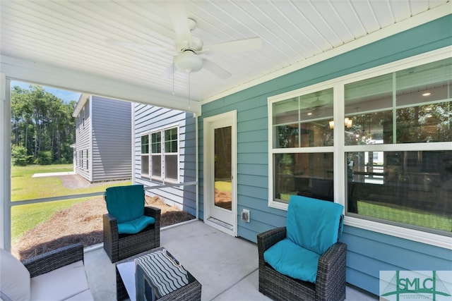 sunroom with ceiling fan and a healthy amount of sunlight