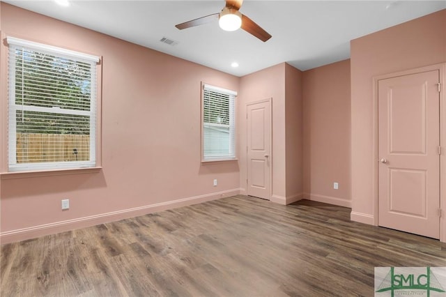 spare room featuring ceiling fan and hardwood / wood-style flooring