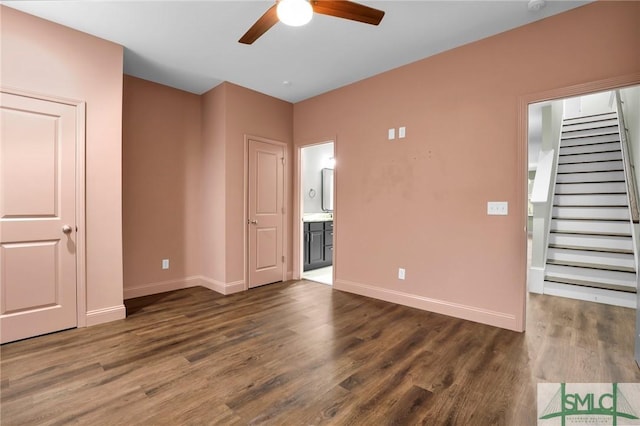 spare room with ceiling fan and dark hardwood / wood-style flooring