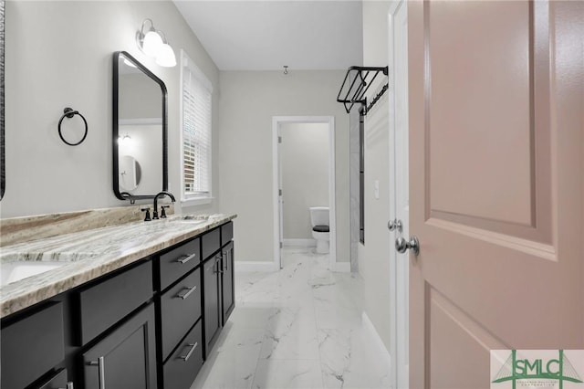 bathroom with vanity and toilet