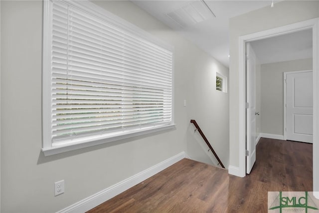 hallway featuring dark hardwood / wood-style flooring