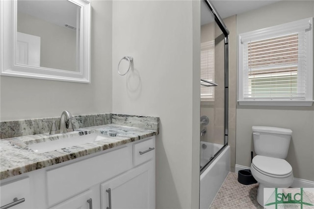 full bathroom with tile patterned flooring, vanity, toilet, and bath / shower combo with glass door