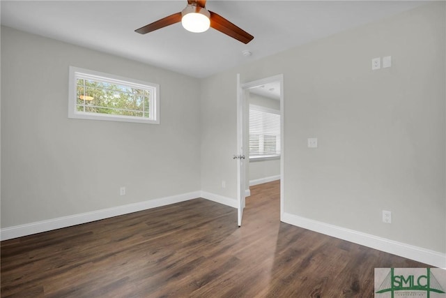 unfurnished room featuring dark hardwood / wood-style floors and ceiling fan