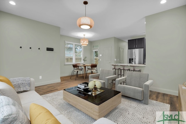 living room with light hardwood / wood-style flooring