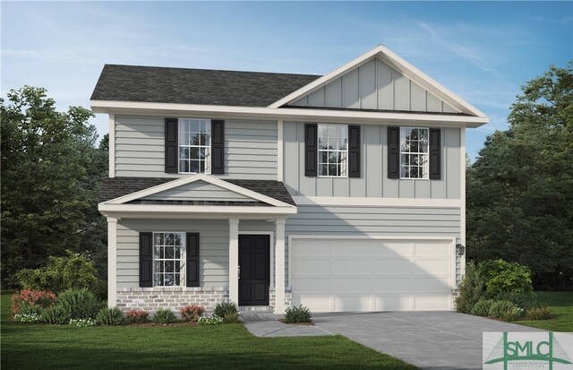 view of front of home featuring a front lawn and a garage