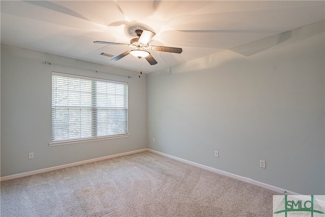 carpeted spare room with ceiling fan