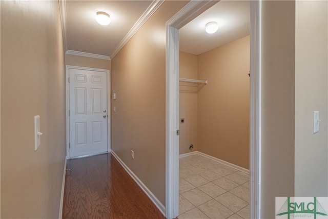 corridor featuring light hardwood / wood-style floors and crown molding