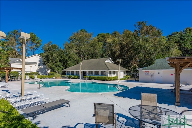 view of pool featuring a patio area and a pergola