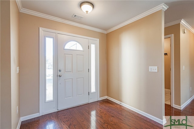 foyer with dark hardwood / wood-style flooring and crown molding