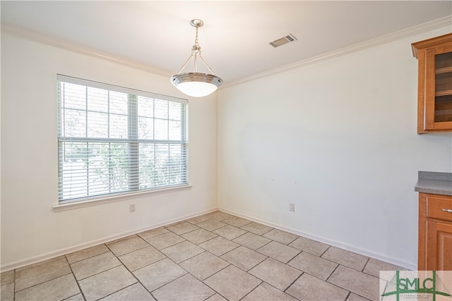 unfurnished dining area featuring ornamental molding