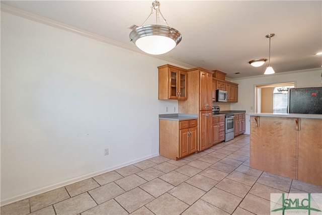 kitchen featuring pendant lighting, ornamental molding, and stainless steel appliances