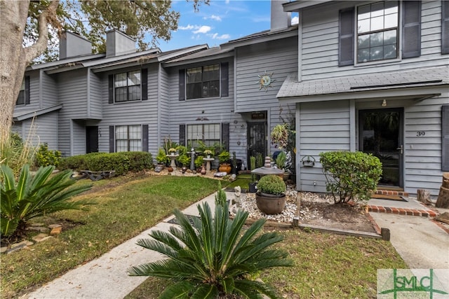 view of property with a front lawn