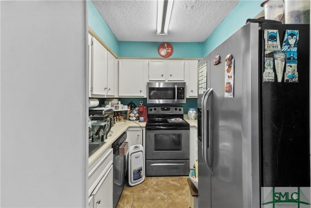 kitchen featuring white cabinets, appliances with stainless steel finishes, and a textured ceiling