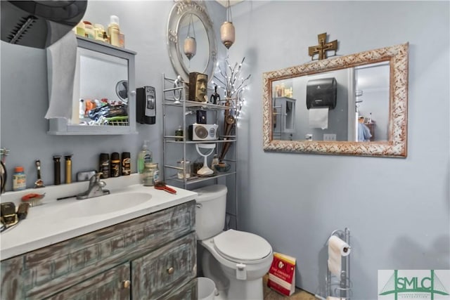 bathroom with vanity and toilet