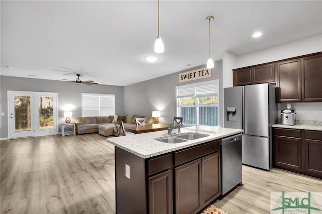 kitchen featuring ceiling fan, sink, stainless steel appliances, and dark brown cabinets