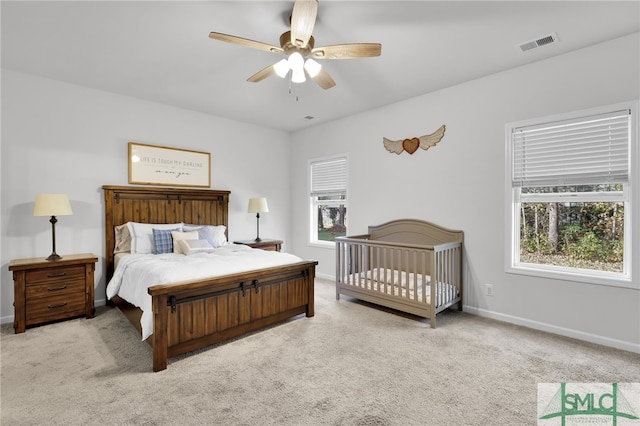 carpeted bedroom featuring ceiling fan