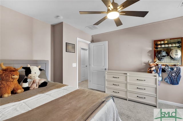 bedroom featuring ceiling fan and light colored carpet