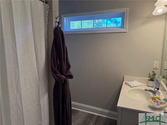 bathroom with hardwood / wood-style flooring and vanity